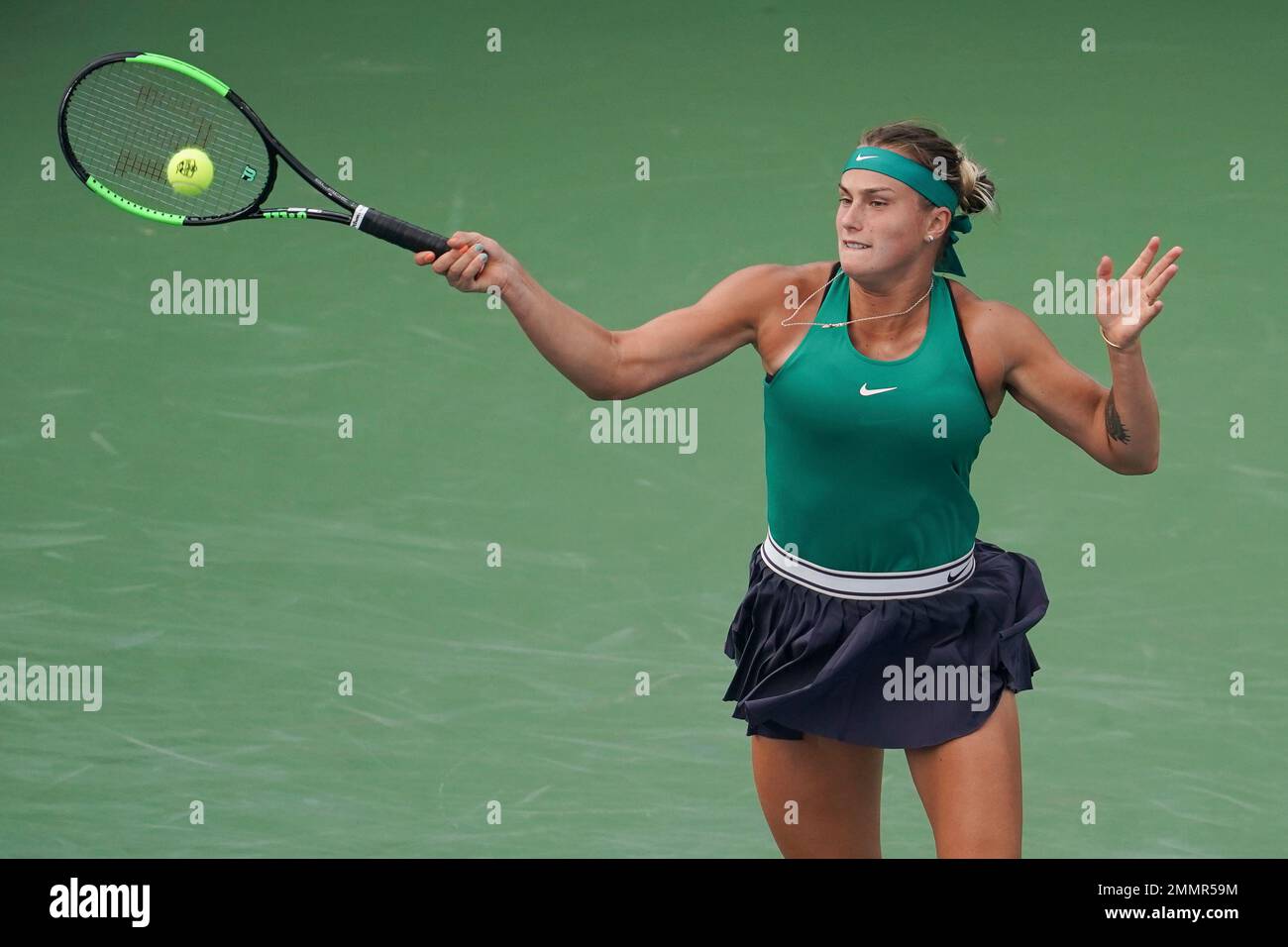 Aryna Sabalenka, of Belarus, returns to Simona Halep, of Romania