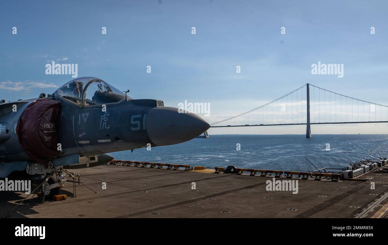 DANISH STRAITS (Sept. 22, 2022) A U.S. Marine Corps  AV-8B Harrier sits on the flight deck aboard the Wasp-class amphibious assault ship USS Kearsarge (LHD 3) as the ship approaches the Great Belt Bridge in the Danish Straits Sept. 22, 2022. The Kearsarge Amphibious Ready Group and embarked 22nd Marine Expeditionary Unit, under the command and control of Task Force 61/2, is on a scheduled deployment in the U.S. Naval Forces Europe area of operations, employed by U.S. Sixth Fleet to defend U.S., allied and partner interests. Stock Photo