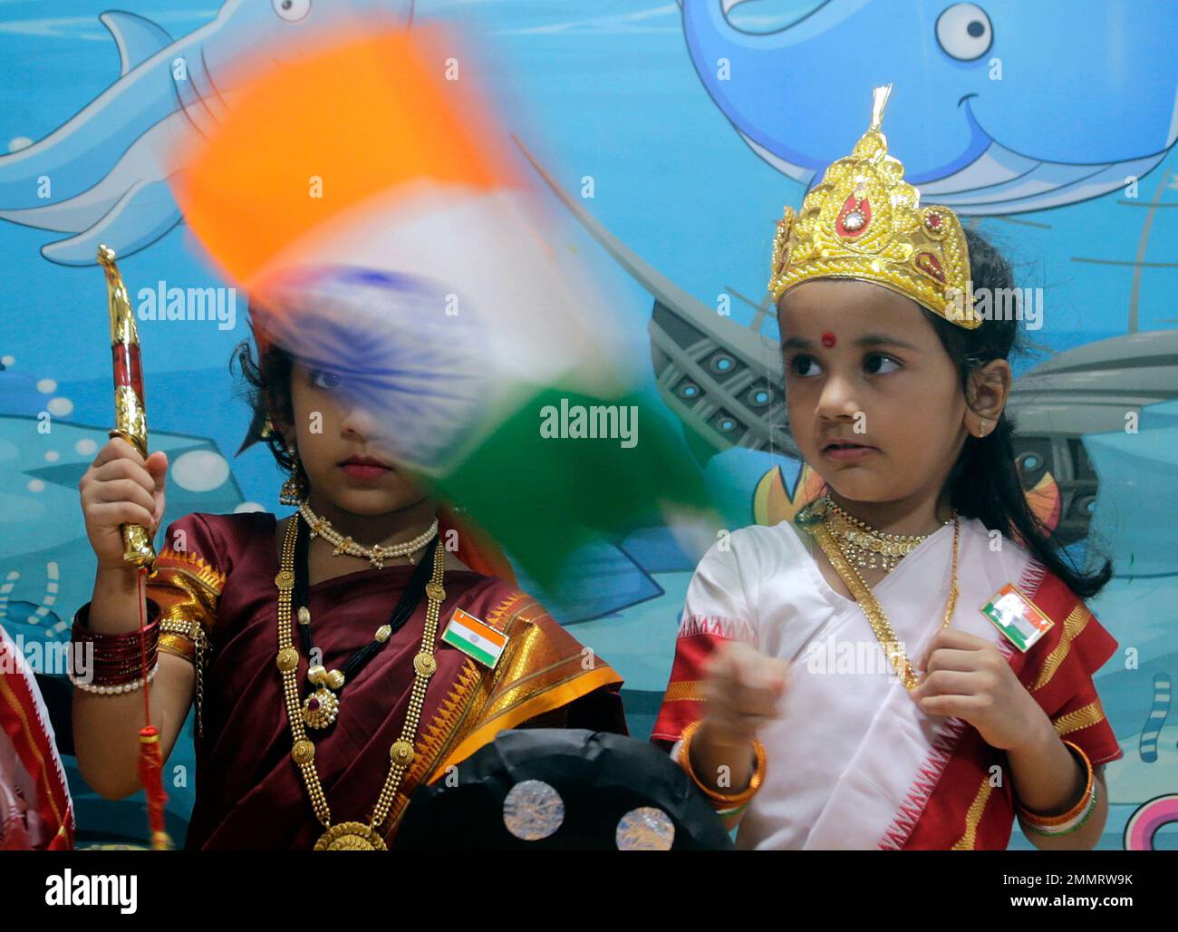 School children dressed as mother India participate in a function to