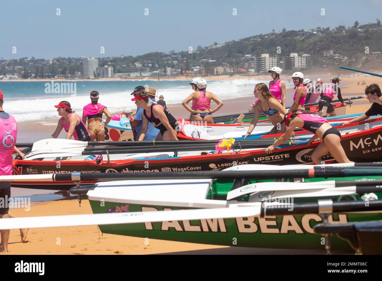 Sydney surfboat racing carnival at North Narrabeen beach, local surf clubs compete in the premiership races,Sydney,NSW,Australia Stock Photo