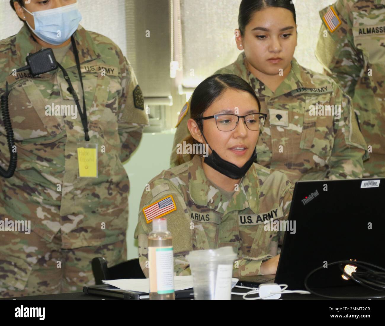 Spc. Linda Arias of Chicago, a member the Illinois Army National Guard's North Riverside, Ill.-based 1970th Quartermaster Co. instructs her fellow Soldiers on a new computer system at a site housing asylum seekers in Chicago. Governor JB Pritzker issued an emergency disaster proclamation on Sept. 14 and activated approximately 75 members of the Illinois National Guard to ensure all state resources are available to support asylum seekers arriving nearly daily to Chicago. The proclamation enables the Illinois Emergency Management Agency (IEMA) and other state agencies, in close coordination with Stock Photo
