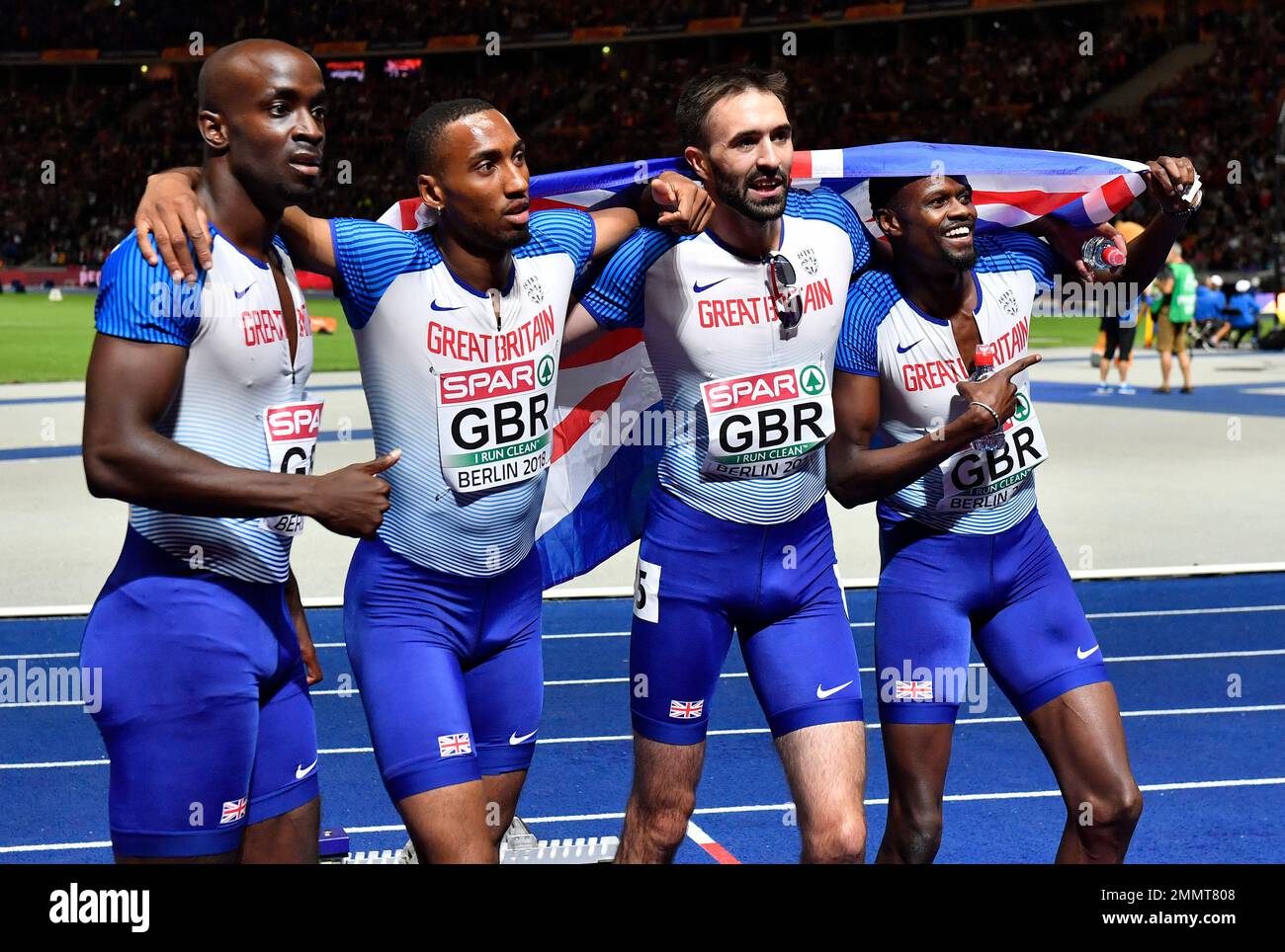 The British team celebrate after winning the silver medal in the men's