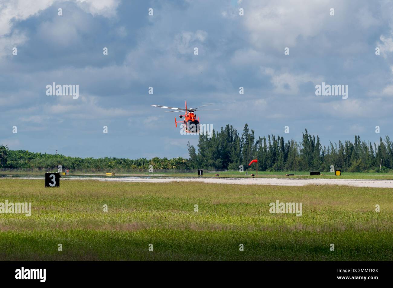 United States Coast Guard MH-65 Dolphin helicopter from Coast Guard Air Station Miami, training at Homestead ARB. Stock Photo