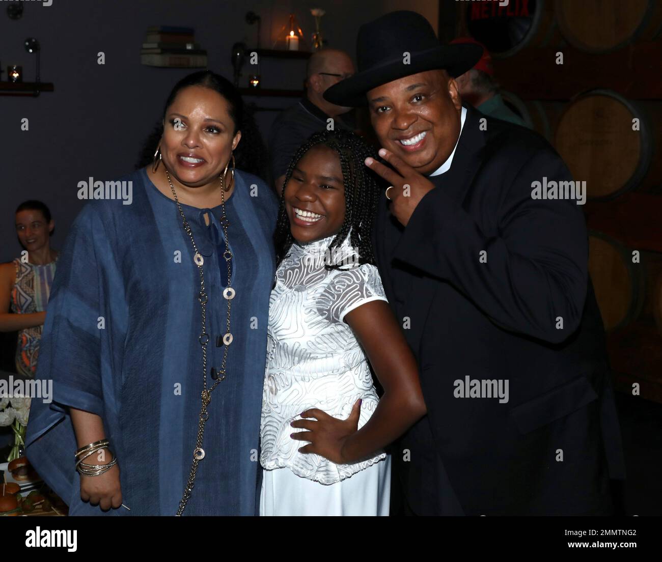 Justine Simmons, from left, Trinitee Stokes and Joseph Simmons are seen