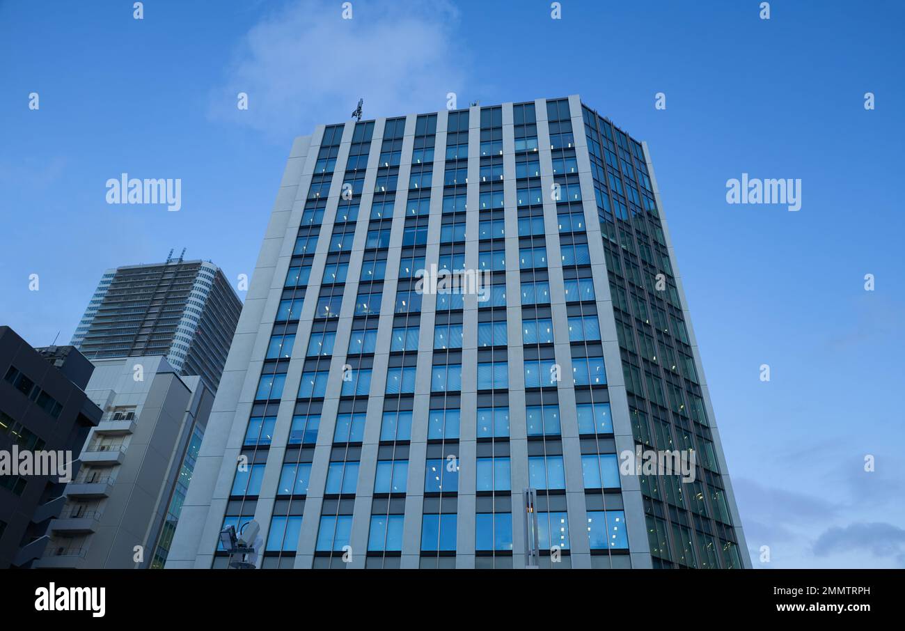 Low angle view of office building exterior in Sapporo Hokkaido, Japan Stock Photo