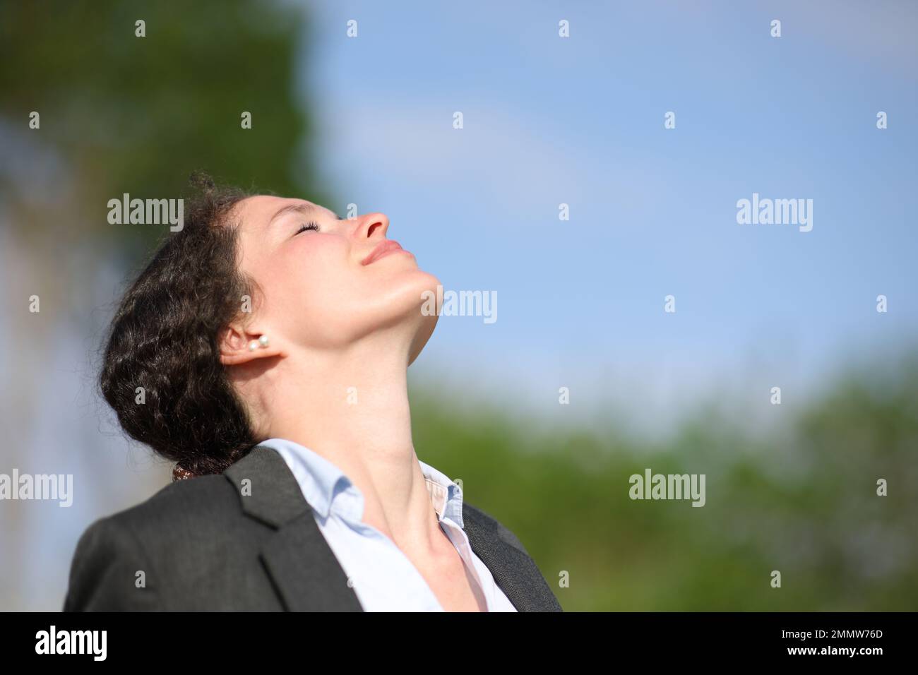 Businesswoman breathing fresh air Stock Photo - Alamy