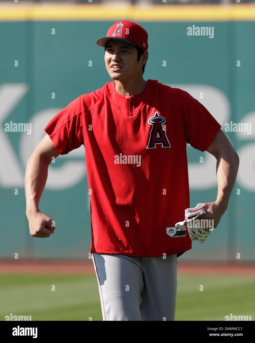 Los Angeles Angels' Shohei Ohtani flexes his muscles before a