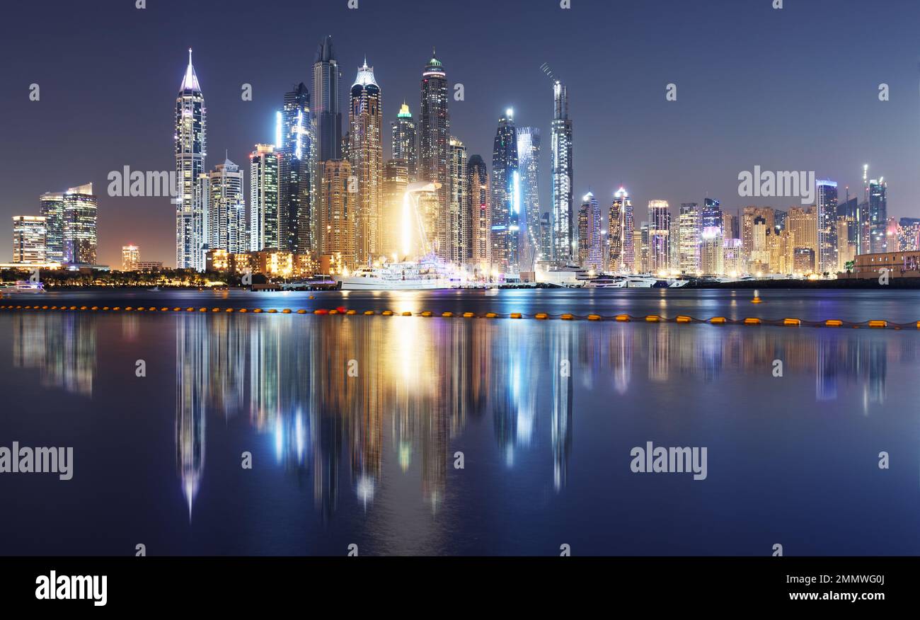 Panorama of Dubai Marina at night with scyscrapers skyline, UAE Stock Photo