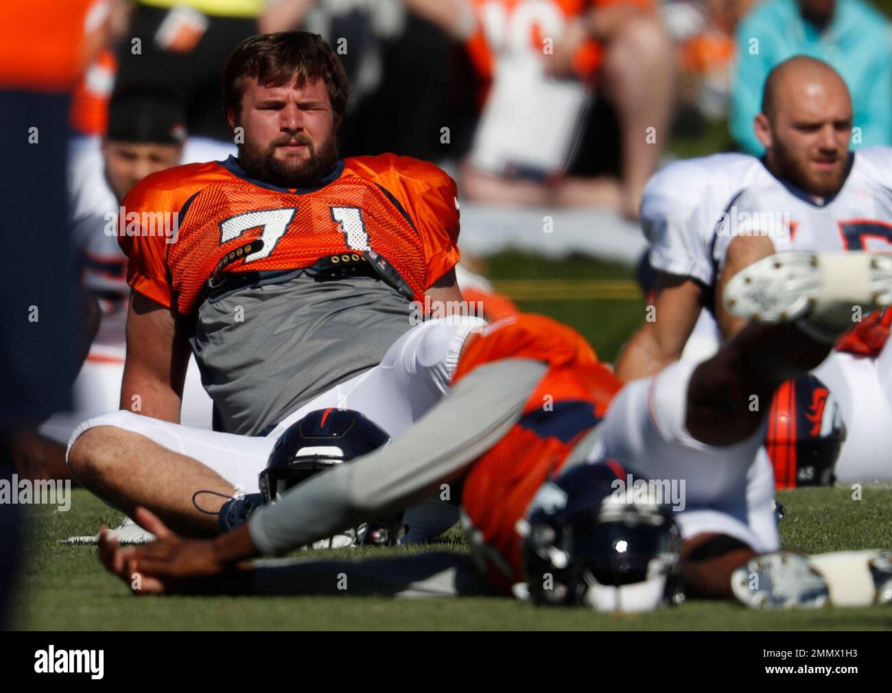 Denver Broncos offensive guard Austin Schlottmann (71) takes part in drills  during an NFL football training camp Friday, Aug. 6, 2021, at the team's  headquarters in Englewood, Colo. (AP Photo/David Zalubowski Stock