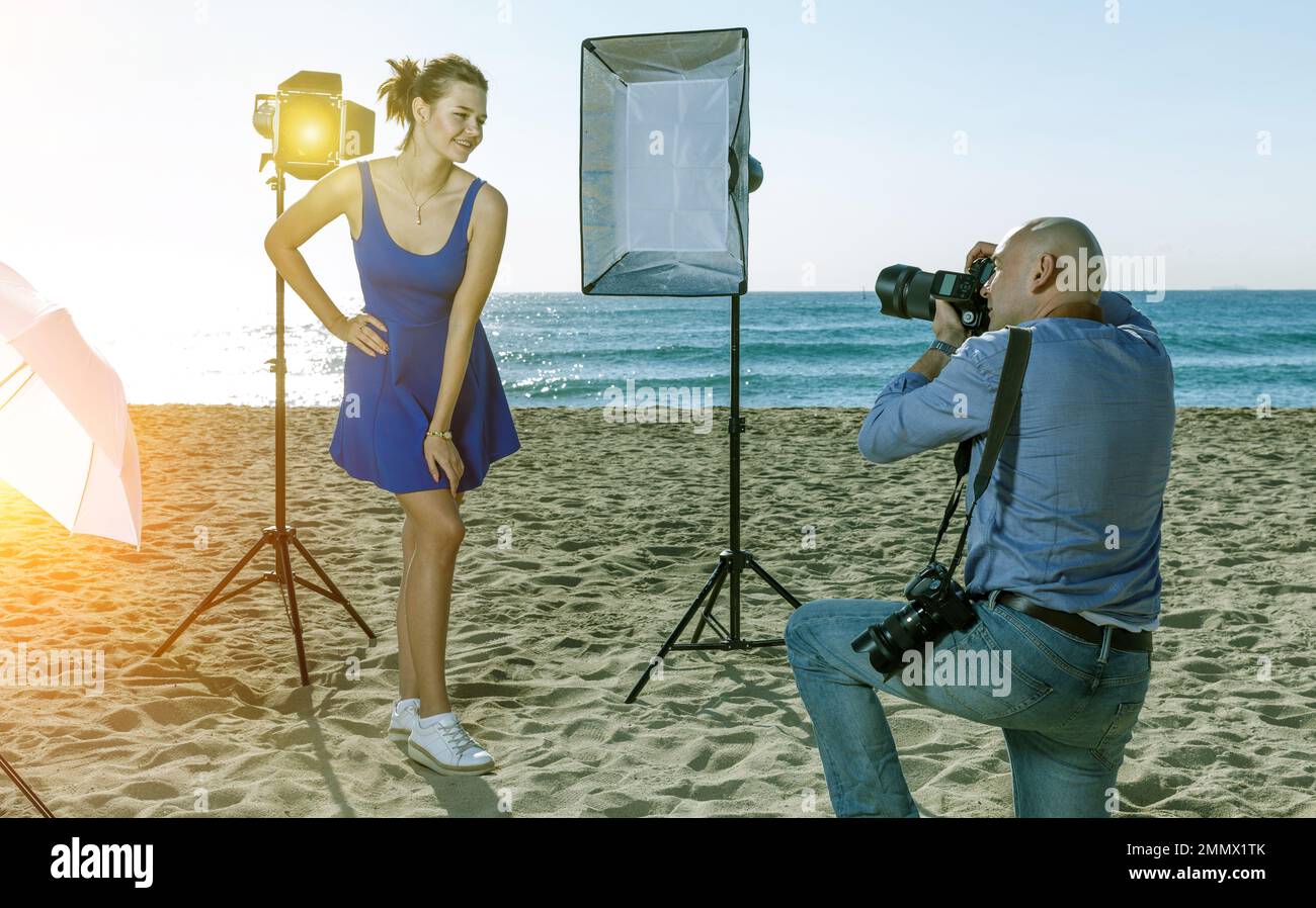 Photo shoot of adult model with photographer Stock Photo - Alamy