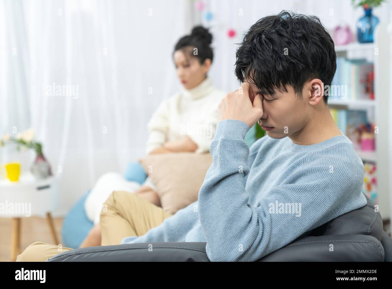 Young lovers quarrel on the sofa in the sitting room Stock Photo - Alamy