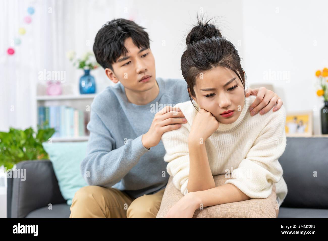 Young lovers quarrel on the sofa in the sitting room Stock Photo - Alamy