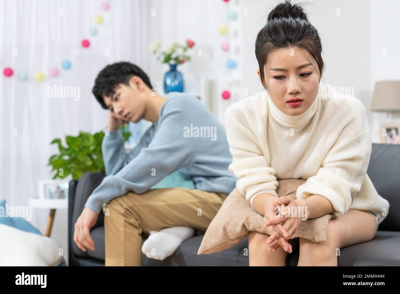 Young lovers quarrel on the sofa in the sitting room Stock Photo - Alamy