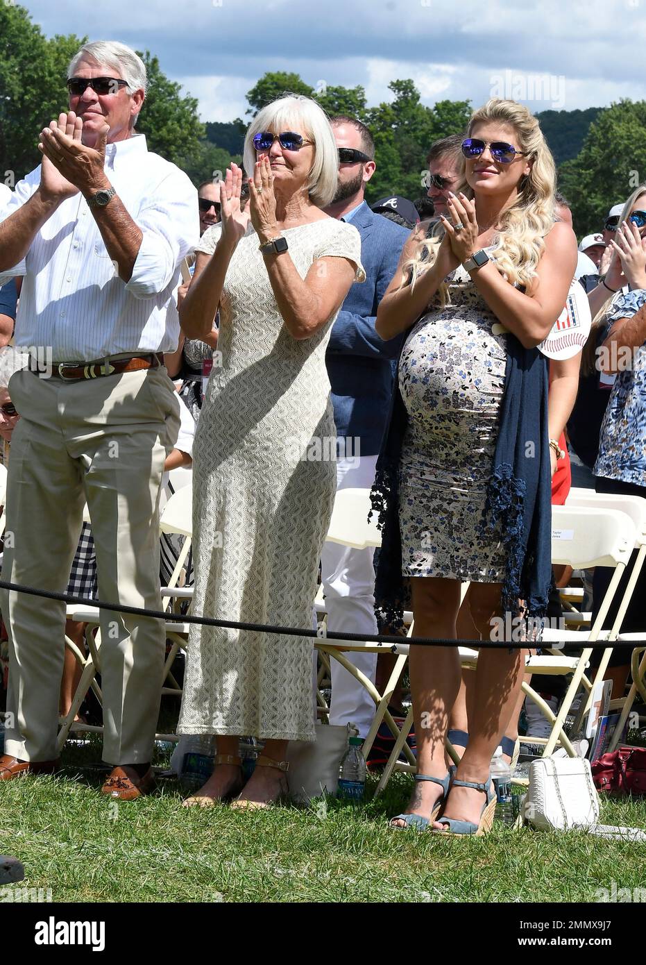 Chipper Jones' family, left to right, father Larry Wayne Jones, Sr., mother  Lynne Jones and his wife Taylor Jones watch his induction speech on Sunday,  July 29, 2018, at the Baseball Hall
