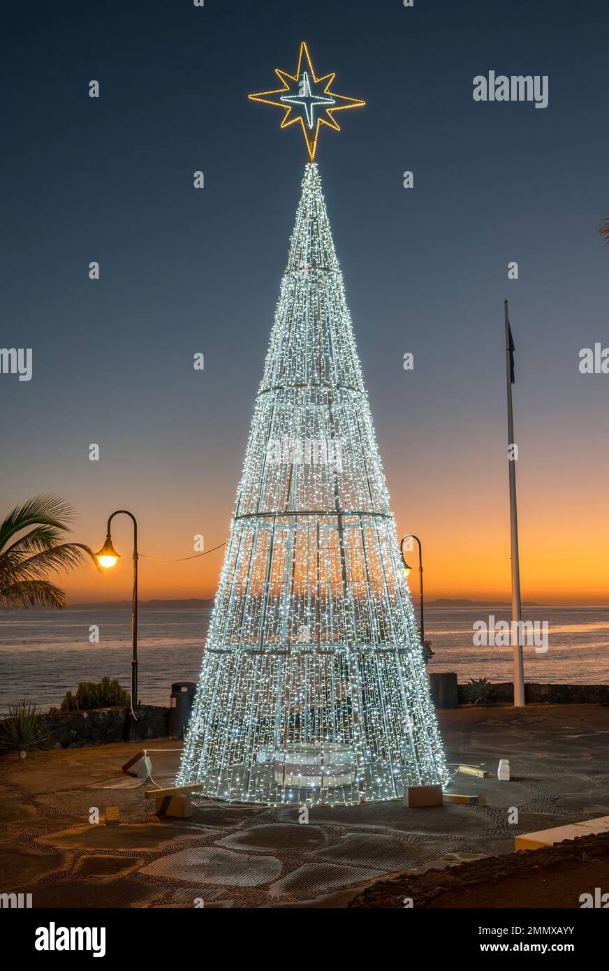 Christmas tree on beach at sunset in Puerto Del Carmen Lanzarote Stock Photo