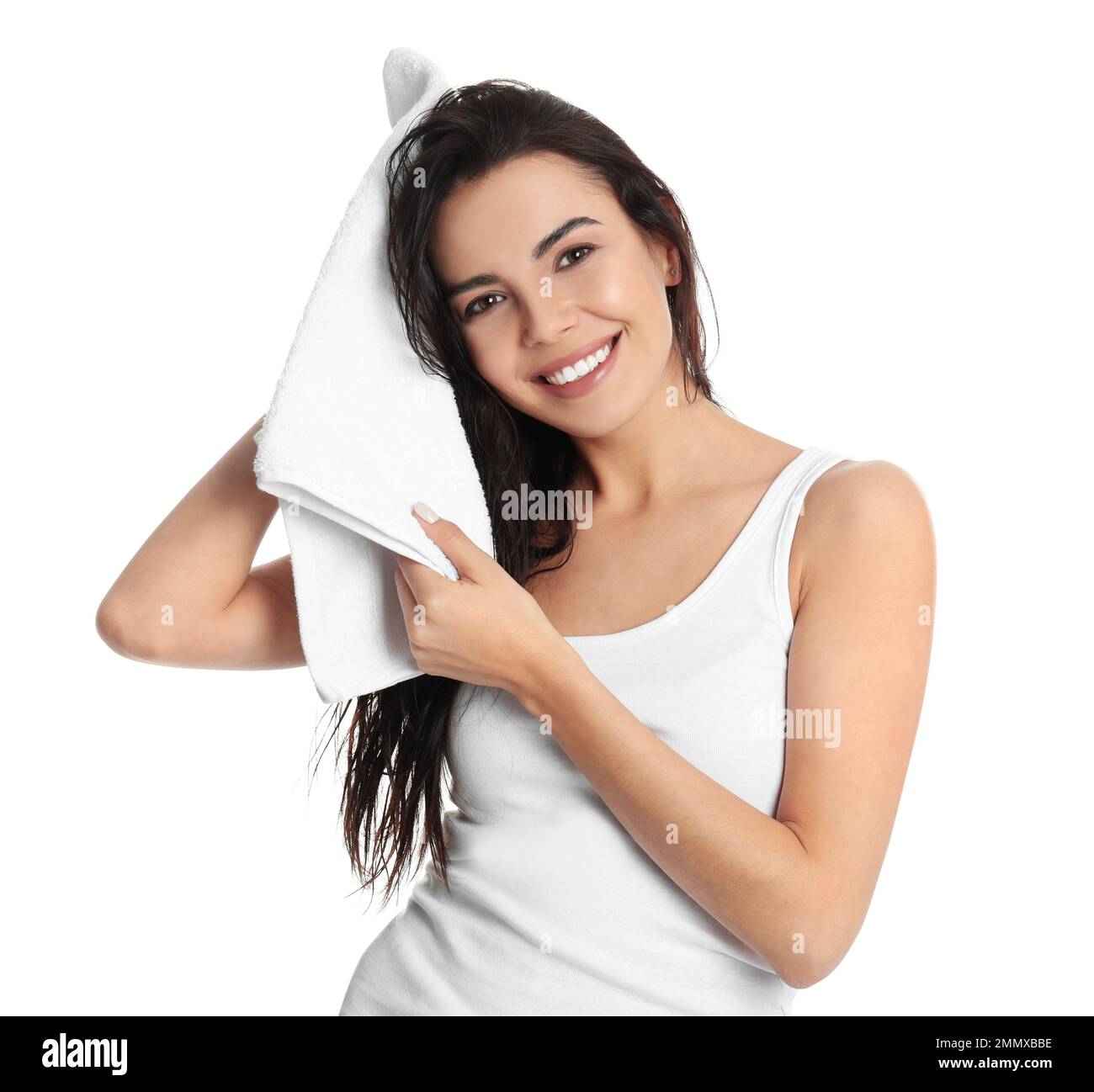 Young woman drying hair with towel on white background Stock Photo - Alamy