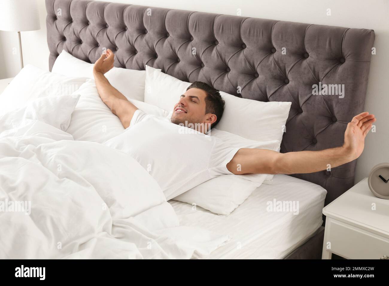 Man awakening on bed hi-res stock photography and images - Alamy