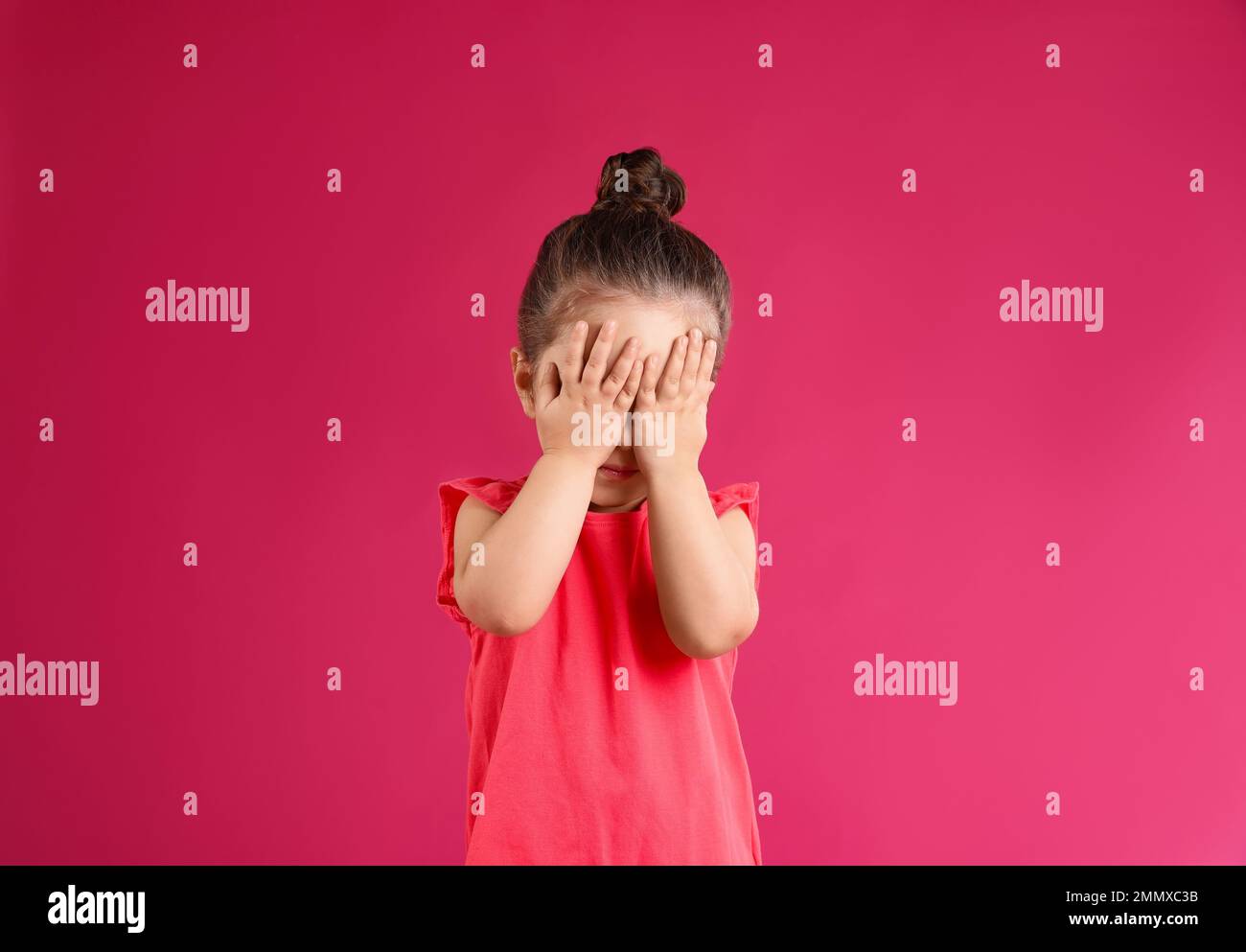 Portrait of cute little girl on pink background Stock Photo - Alamy