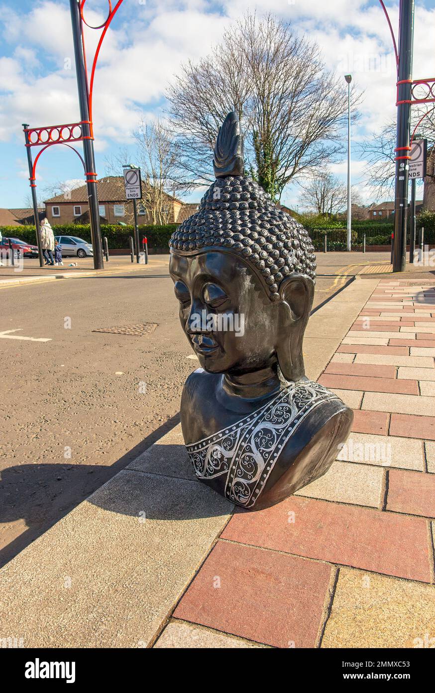 Buddha head for sale displayed in road ouitside Barras Market, Glasgow, Scotland Stock Photo