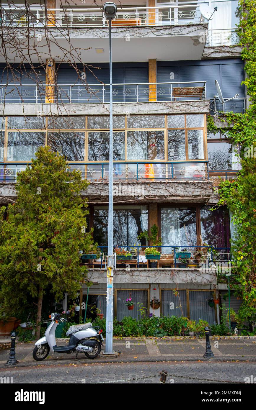 View of New apartment building with large balconies with glass railings. Modern ...