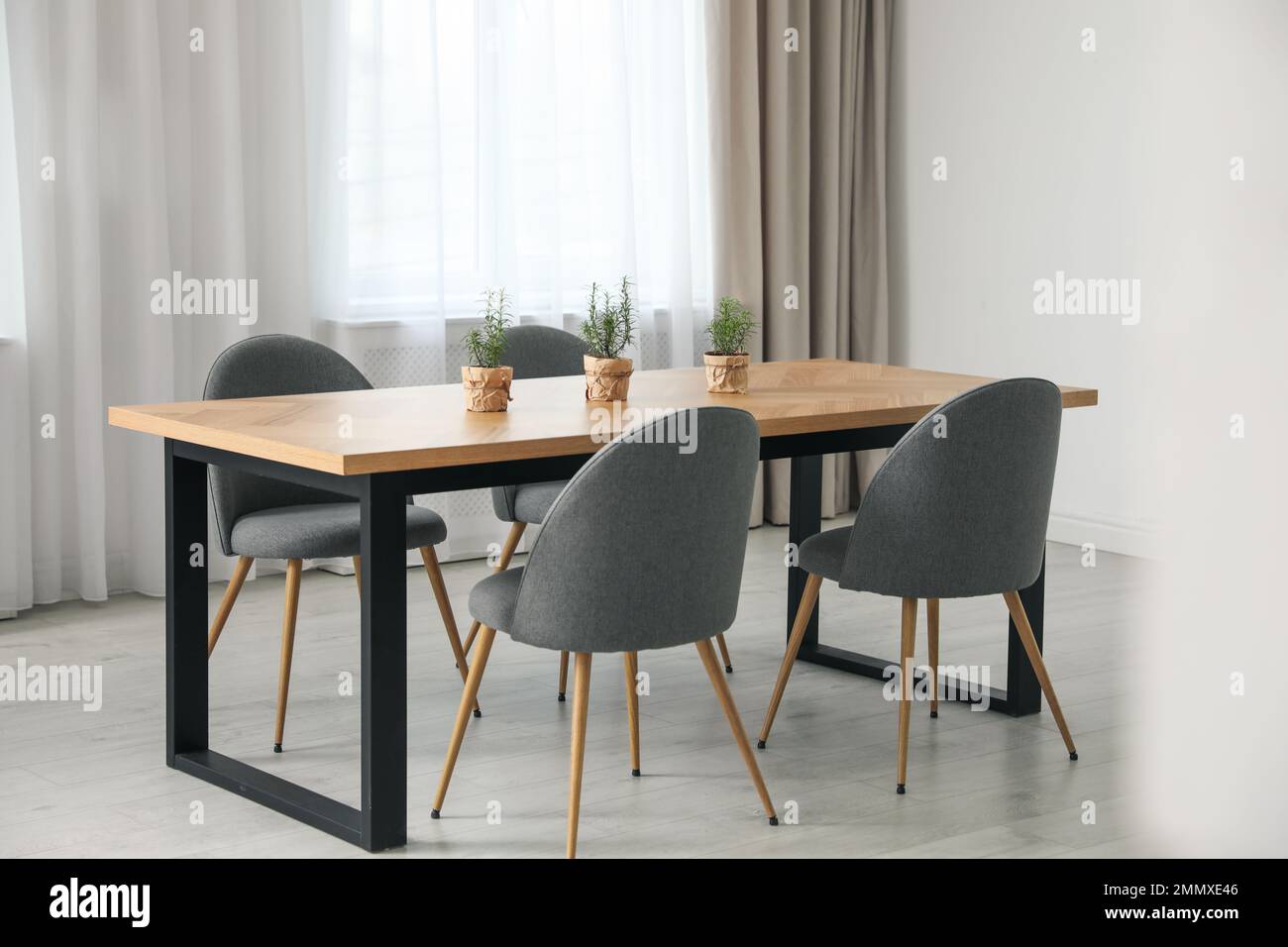 Modern room interior with chairs and table Stock Photo - Alamy