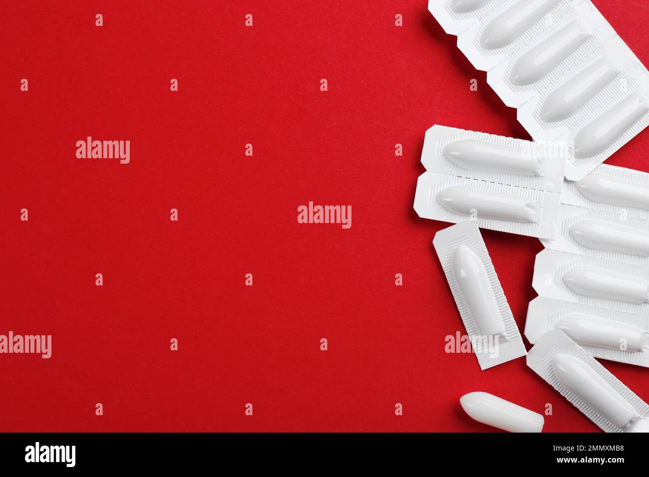 Sepositories Tablet Red Suppositories and space for text on red background, flat lay ...