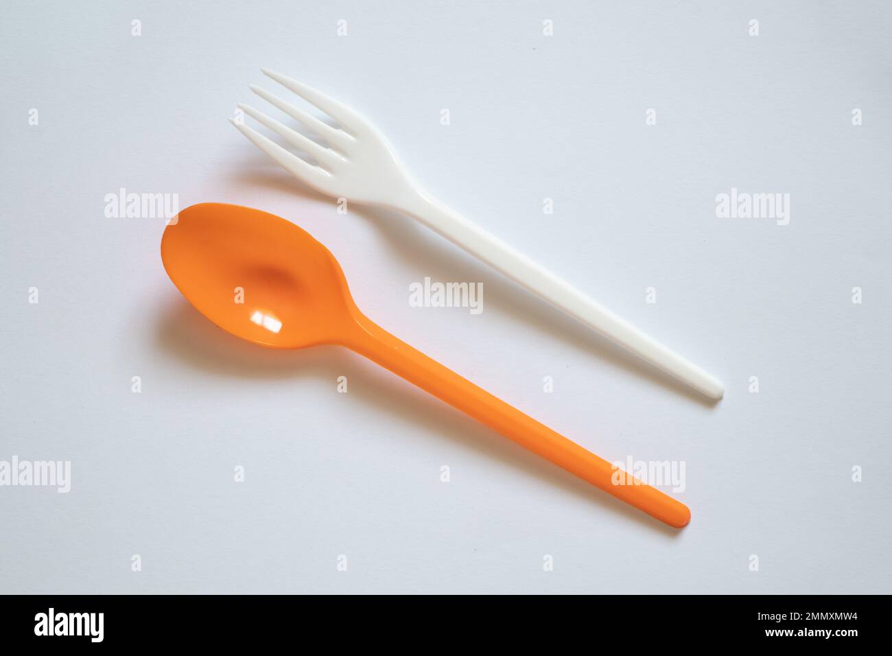 plastic disposable spoon and fork on isolated background, disposable
