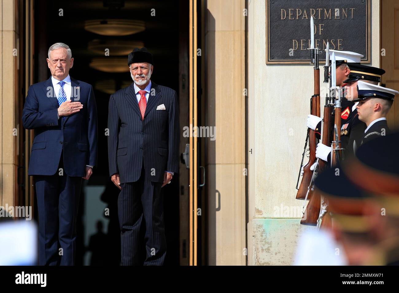 Secretary of Defense Jim Mattis, left, puts his hand over his heart as ...