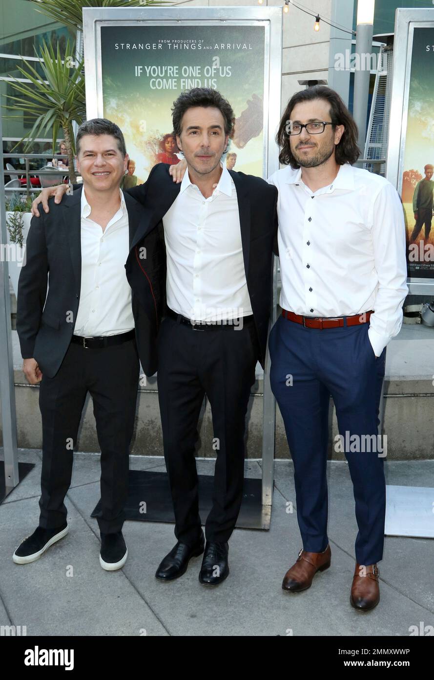 Dan Levine, from left, Shawn Levy and Dan Cohen arrive at the LA