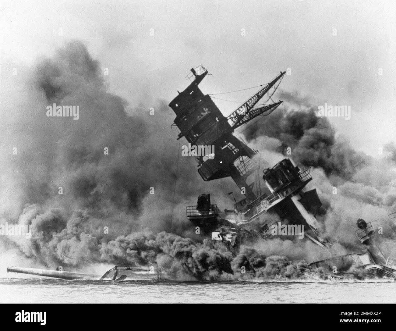 FILE - In this Dec. 7, 1941, file photo, smoke rises from the battleship USS Arizona as it sinks during a Japanese surprise attack on Pearl Harbor, Hawaii. A newly released memo by a wartime Japanese official provides what a historian says is the first look at the thinking of Emperor Hirohito and Prime Minister Hideki Tojo on the eve of the Japanese attack on Pearl Harbor that thrust the U.S. into World War II. (AP Photo, File) Stock Photo