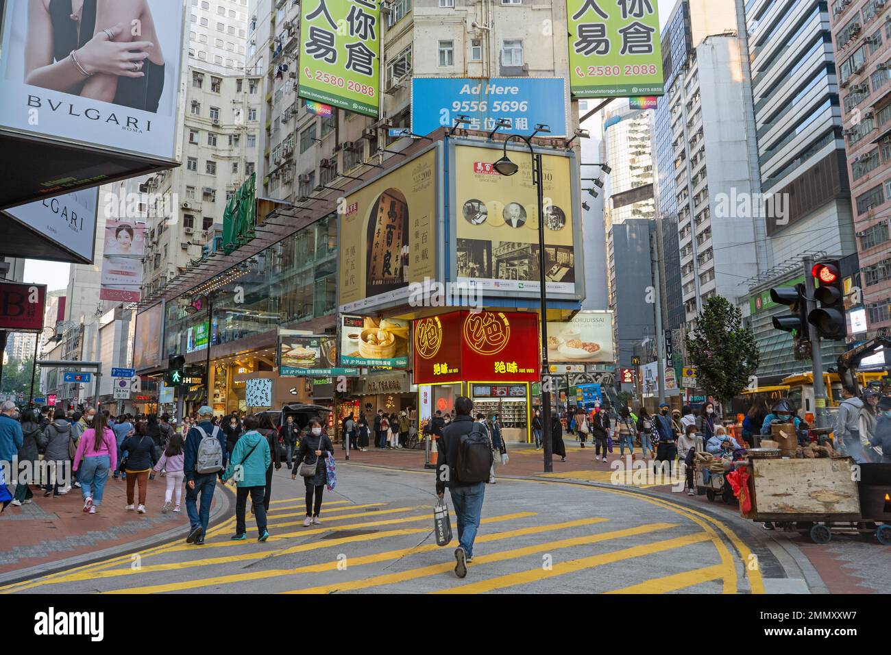 Hong Kong December 2022 Busy street intersection and zebra crossing