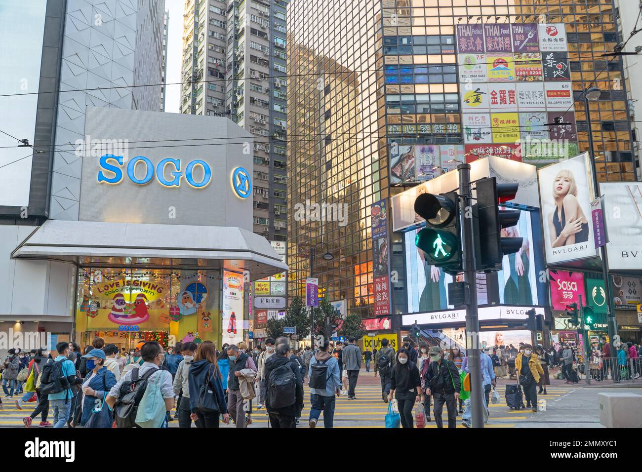 Hong Kong December 2022 Busy street intersection and zebra crossing