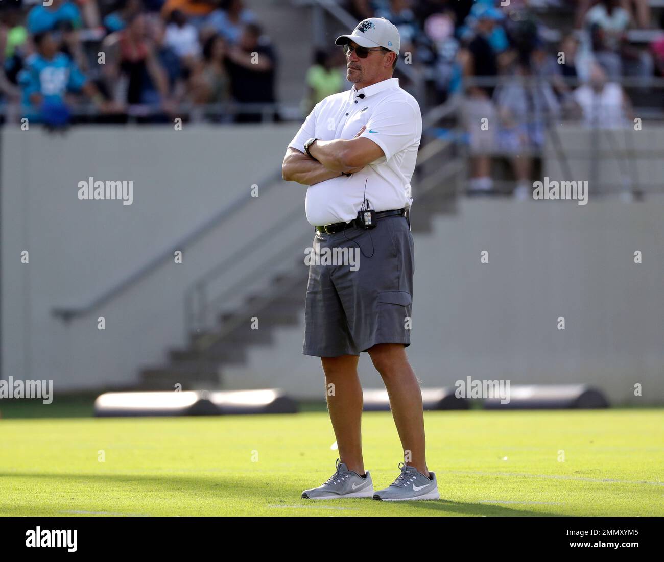 Carolina Panthers head coach Ron Rivera watches players during an NFL football practice at training camp in Spartanburg, S.C., Thursday, July 26, 2018. (AP Photo/Chuck Burton) Stock Photo