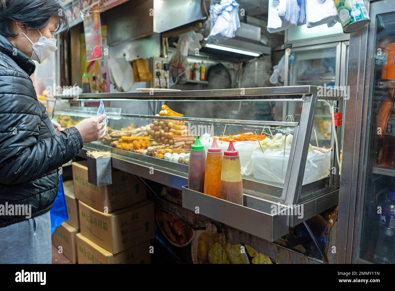 Hong Kong - December 2022 - Street Food stand in Mong Kok Stock Photo