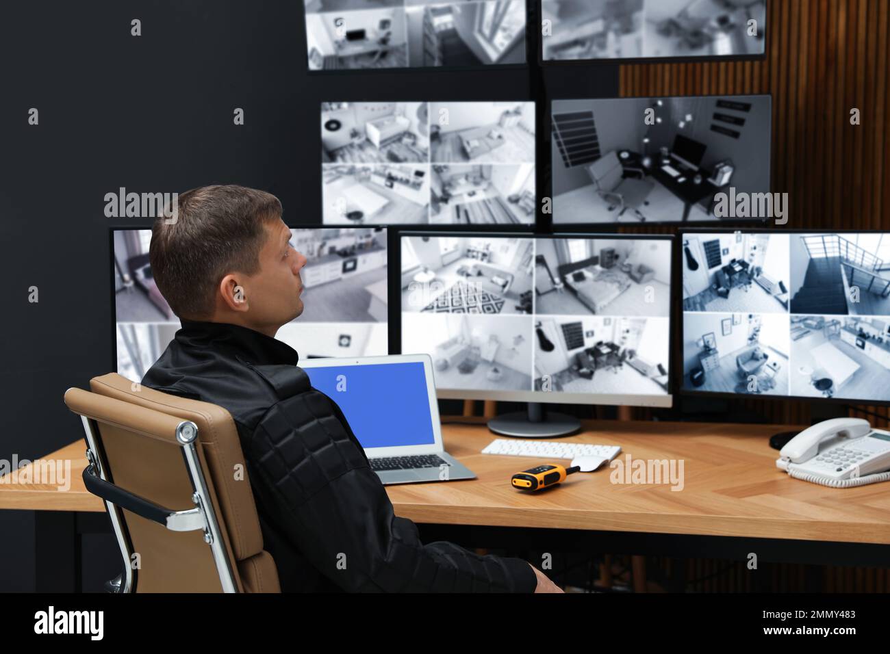 Security guard monitoring modern CCTV cameras indoors Stock Photo Alamy