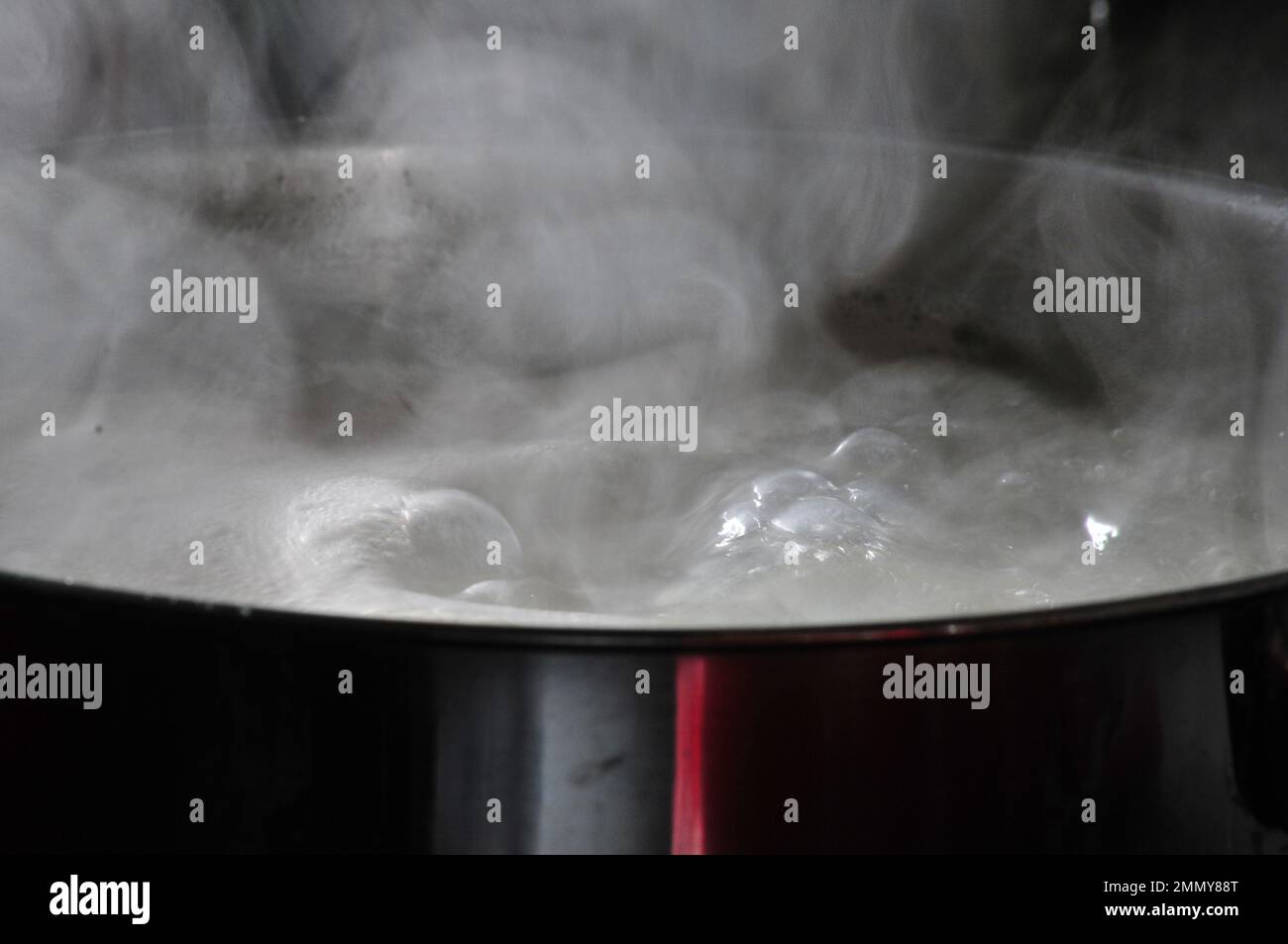 Pot full of boiling water Stock Photo