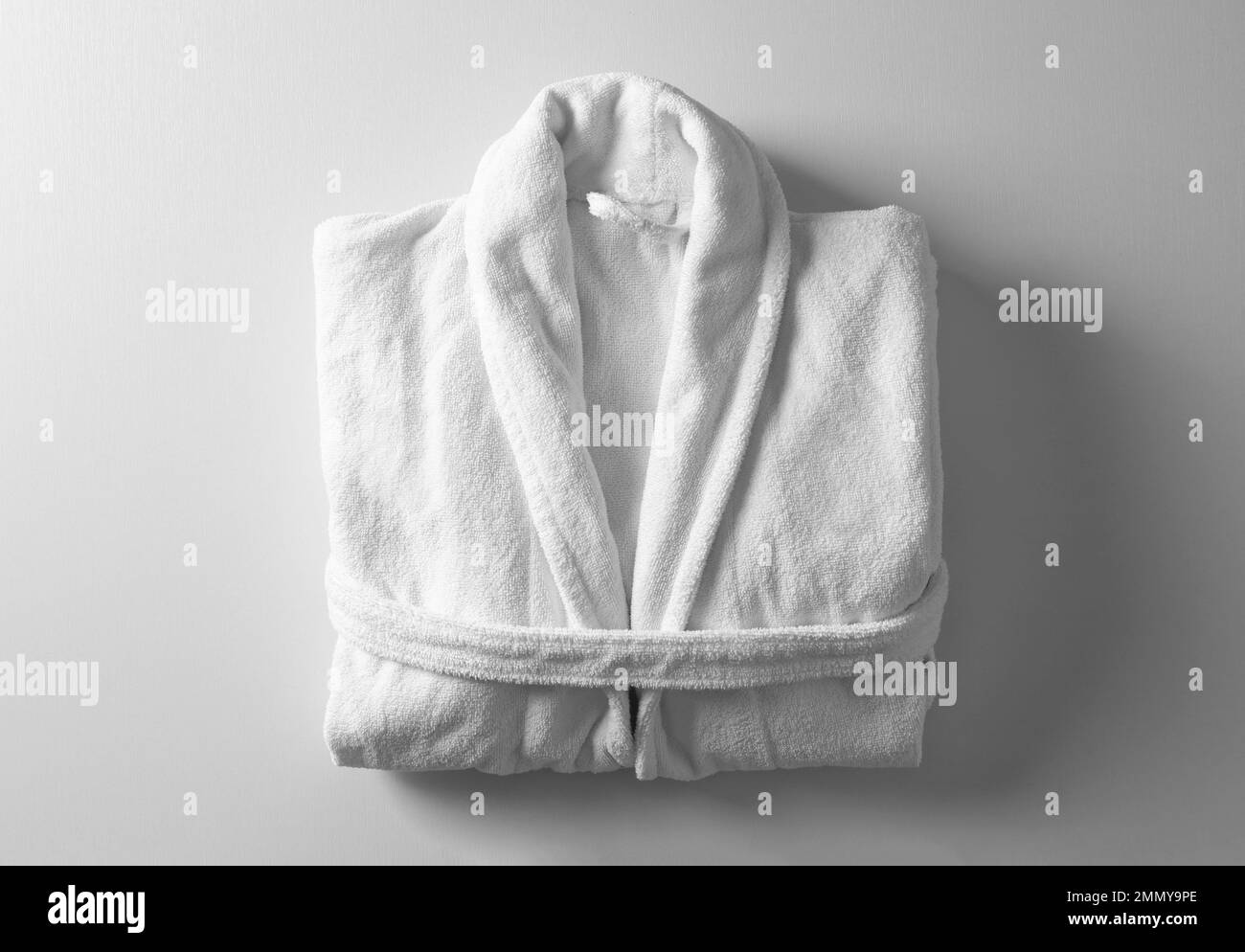 Clean folded bathrobe on white background, top view Stock Photo Alamy