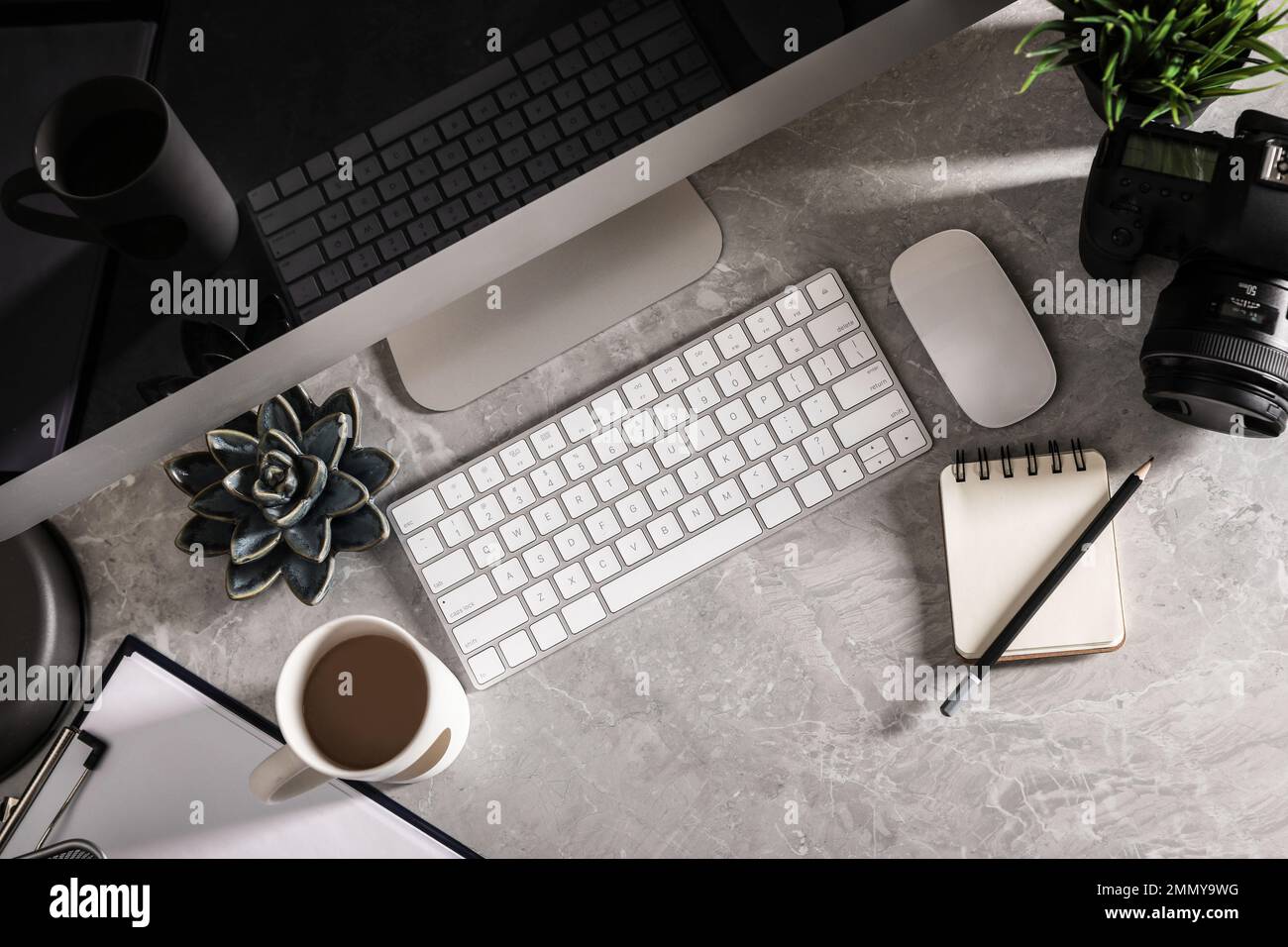Designer's workplace with modern computer and camera, flat lay Stock ...