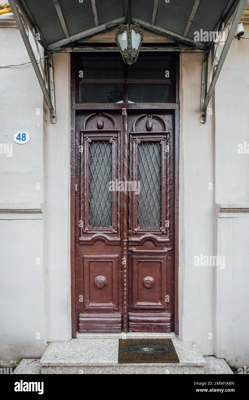 Vintage wooden brown door of old house Stock Photo - Alamy