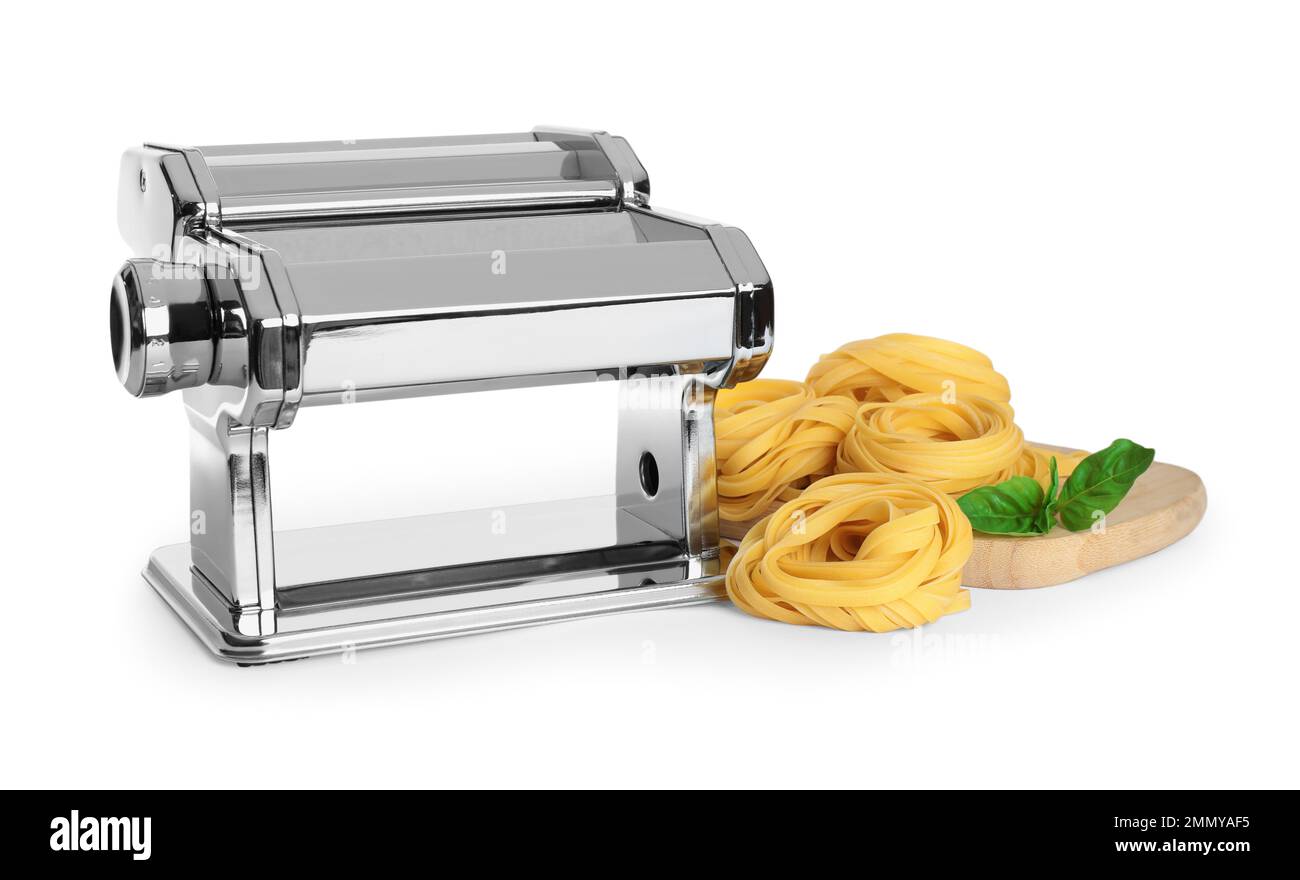 Modern pasta maker machine and tagliatelle isolated on white Stock Photo Alamy