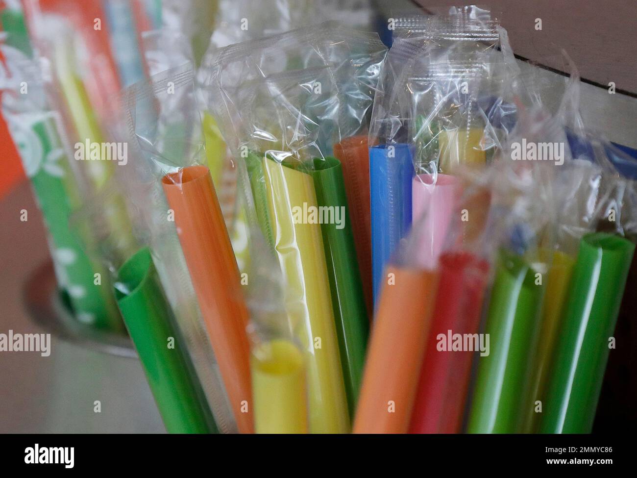 This July 17, 2018 photo shows wrapped plastic straws at a bubble tea
