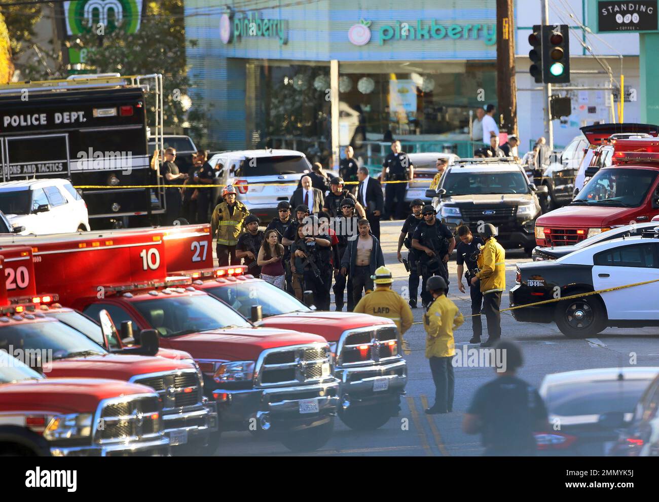 Los Angeles Police SWAT officers escort a group of Trader Joe's ...