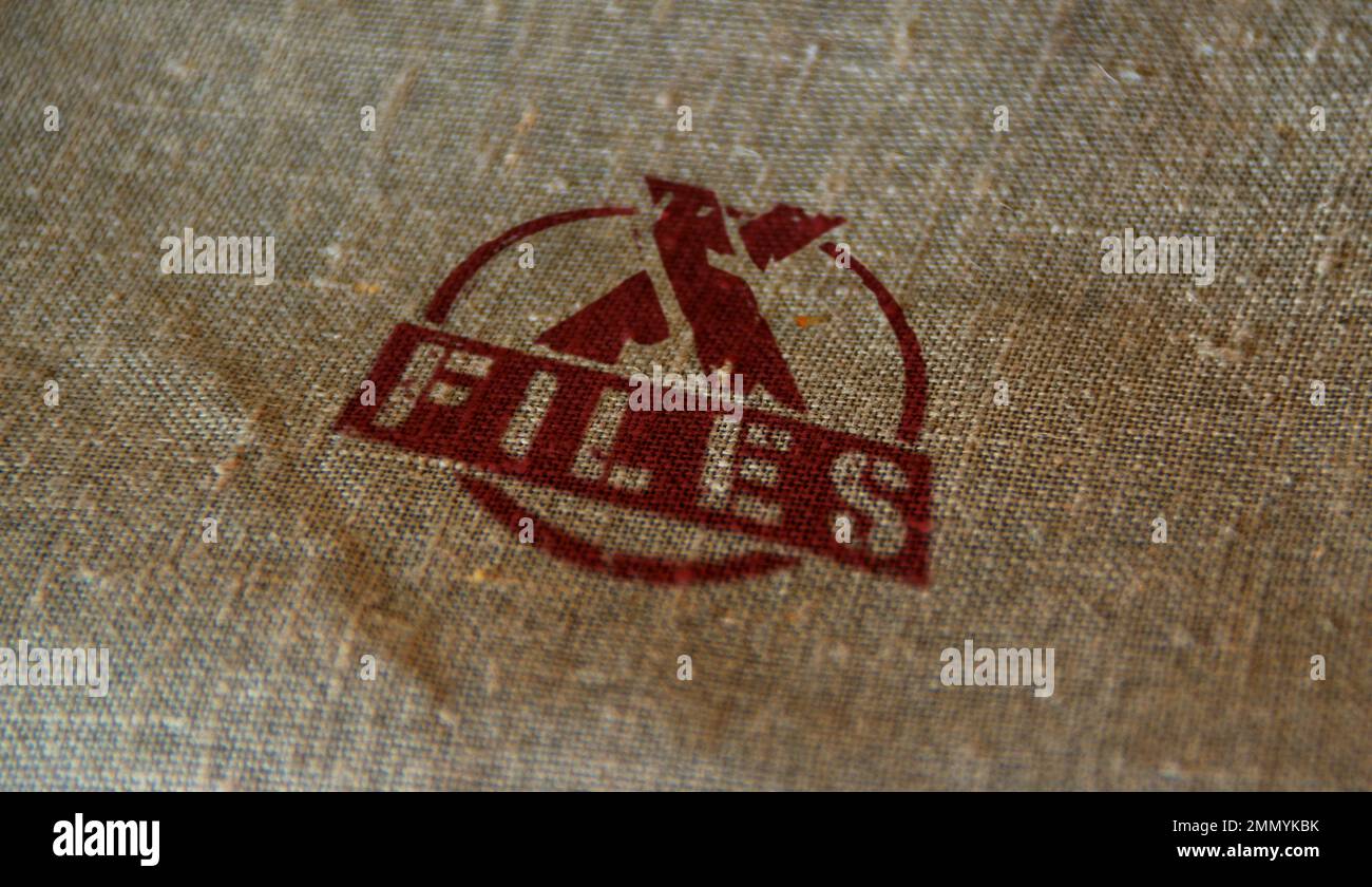 X Files stamp printed on linen sack. Secret mystery investigation and conspiracy concept. Stock Photo