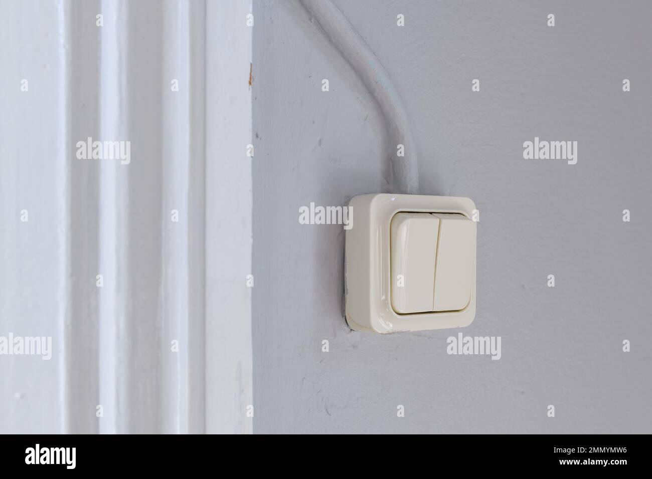 Old retro light switch in living room, selective focus Stock Photo