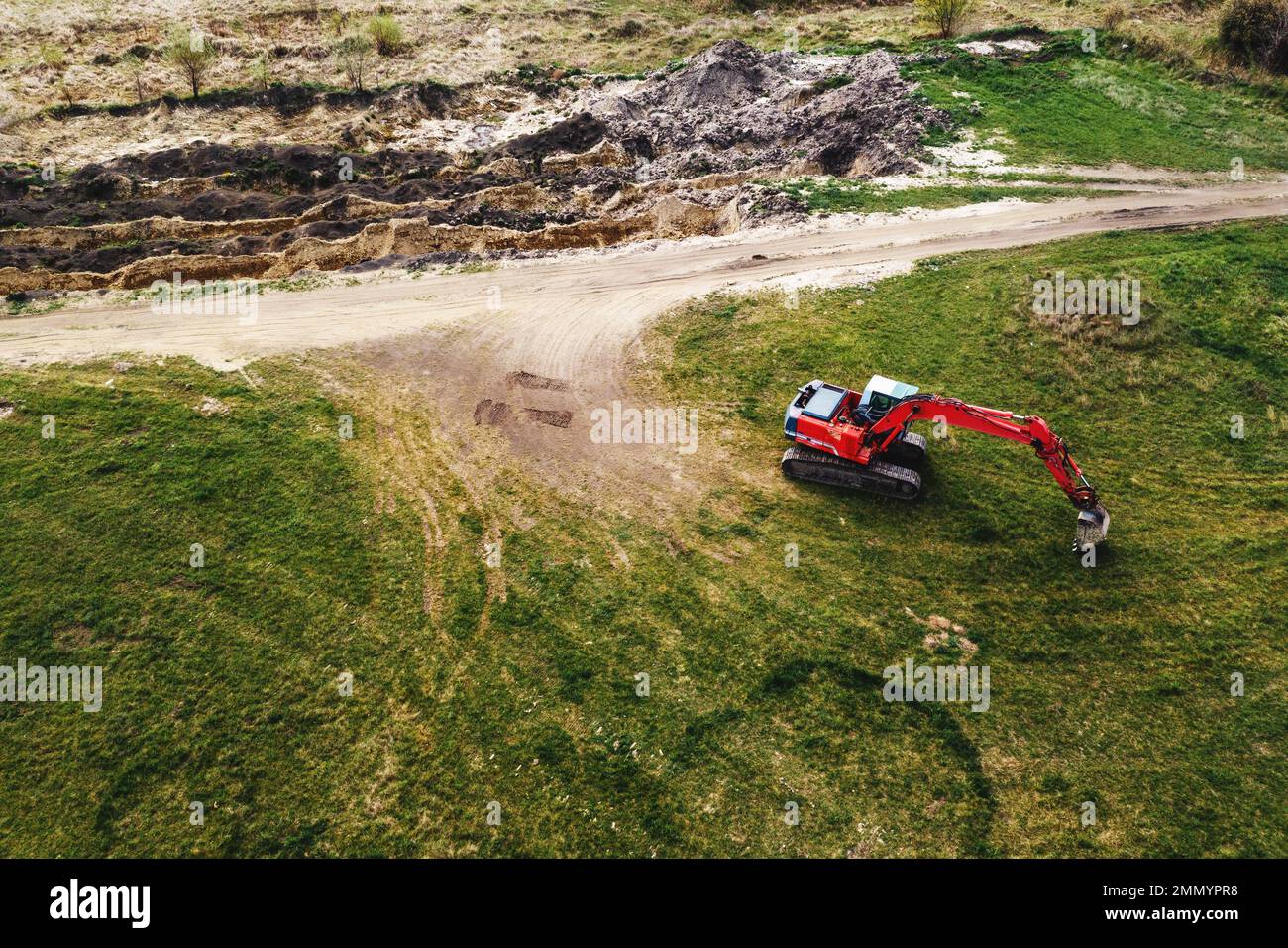 Excavator machinery on archaeological site, aerial shot from drone pov, high angle view Stock Photo