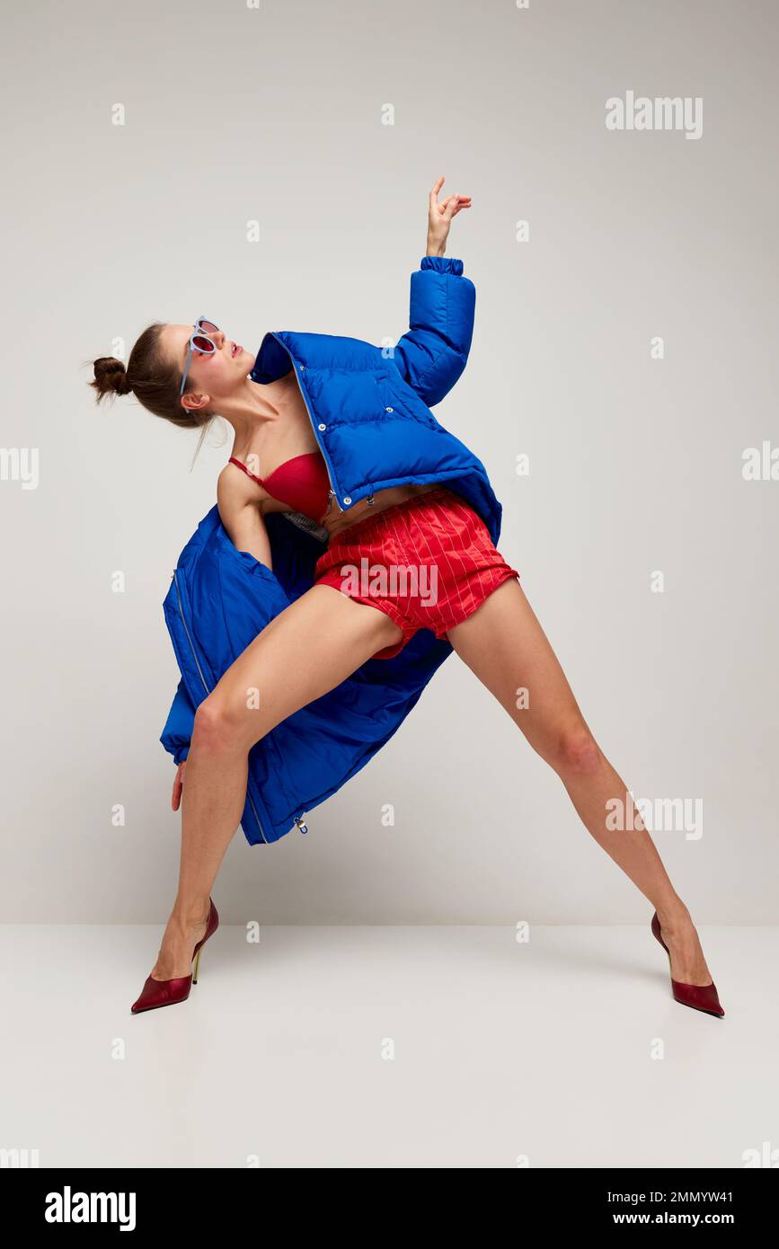 Young girl poses portrait red hi-res stock photography and images