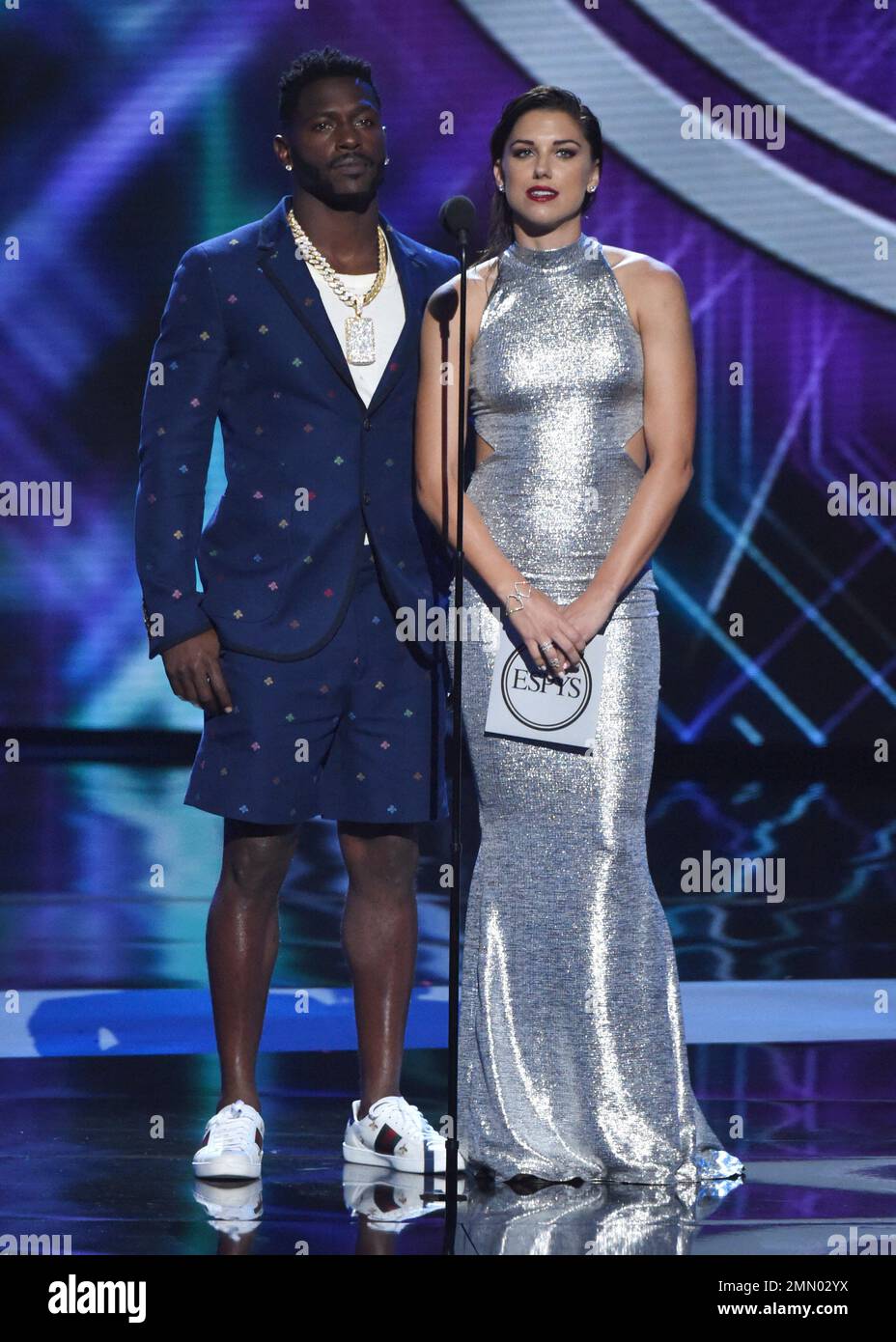 Antonio Brown, left, and Alex present the award for best Olympic