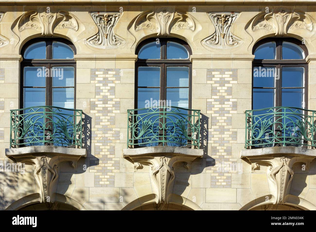 France, Meurthe et Moselle, Nancy, detail of the facade of the Victor Luc house, a mansion in Art Nouveau style built between 1901 and 1903 by architect Jacques Rene Hermant for Victor Luc who used to run a tannery and a leather tanning plant, ironwork made of wrought iron of the window railings by Louis Majorelle, frieze representing flowers under the cornice by ceramists Gentil and Bourdet located Rue de Malzeville Stock Photo