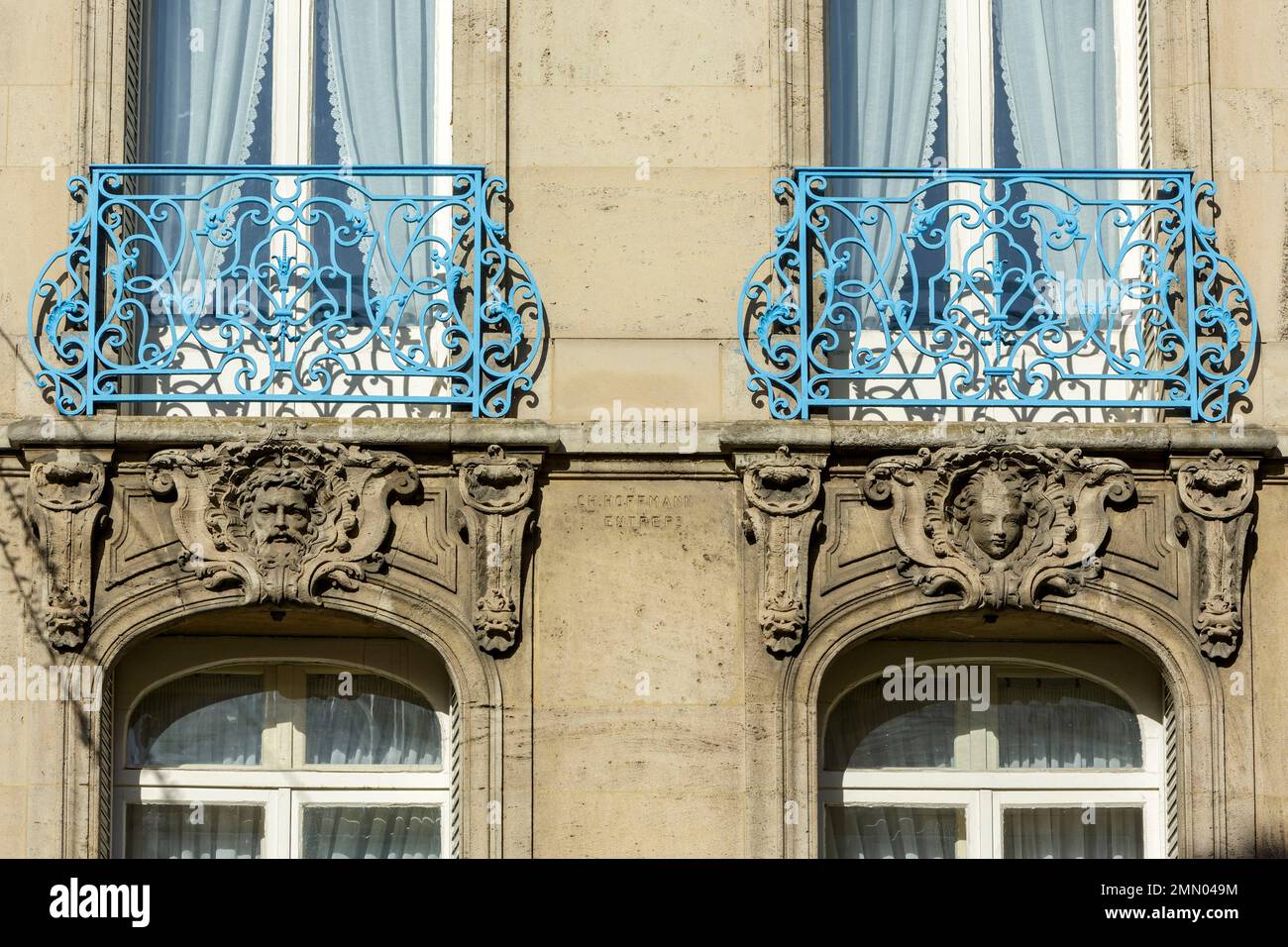 France, Meurthe et Moselle, Nancy, facade of an apartment building with mascaron ornament and window railings made of wrought iron located at the corner of Rue stanislas and Rue des Michottes Stock Photo