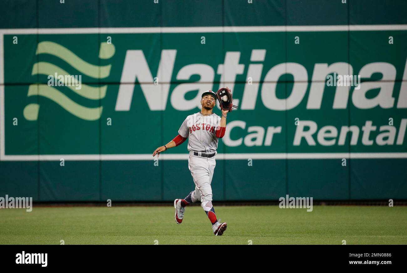 Boston Red Sox outfielder Mookie Betts (50) catches a fly ball hit by ...